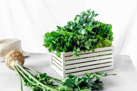 Freshly herbs in wooden box on white background. Harvesting conceptの写真素材