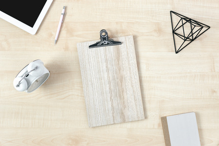 Feminine workspace with ?lipboard and accessories top viewの写真素材