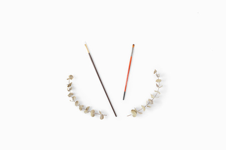 Paint brushes on white background top view flat lay