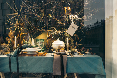 Stylish Christmas composition in a shop window. Festive decor in the shop window. Stockholm, Sweden