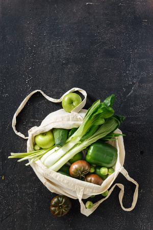Green Food Assortment With Fabric Eco Bag On Dark  Copy Space Top View Flat Lay. Concept Of Conscious Consumptionの写真素材