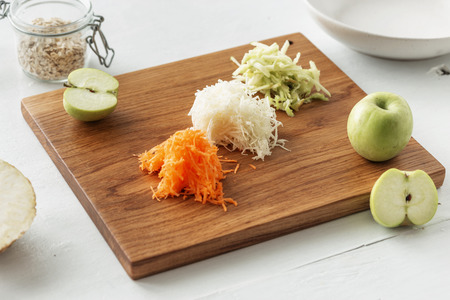 Cutting board with ingredients for preparation fruit salad Healthy breakfast conceptの写真素材