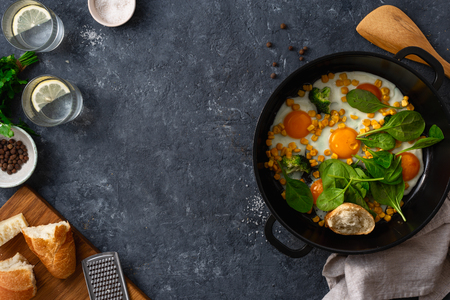 Healthy breakfast eggs top view on dark stone  with copy spaceの写真素材