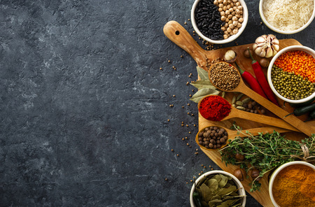 Spices, herbs, rice and various beans and seasonings for cooking on dark  with copy space top viewの写真素材
