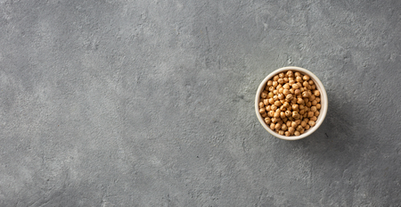 Bowl raw chickpeas on concrete  with a copy space top viewの写真素材
