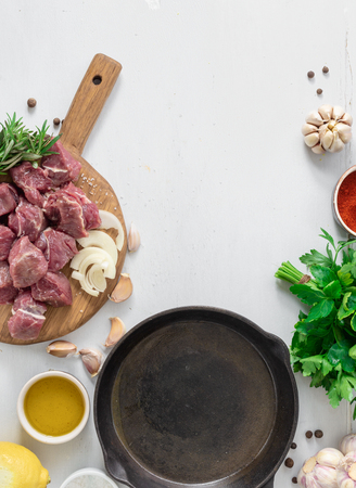 Ð¡ut of meat with vegetable on white wooden  top viewの写真素材