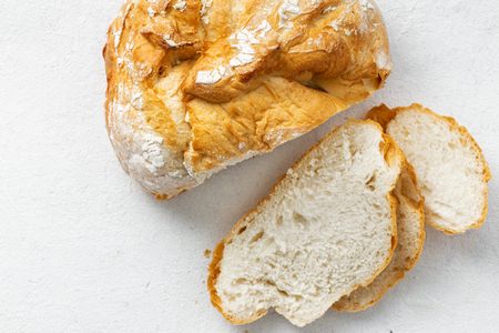 Bread slice on a white  top view