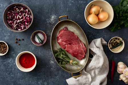 Raw meat with ingredients for cooking healthy food top viewの写真素材