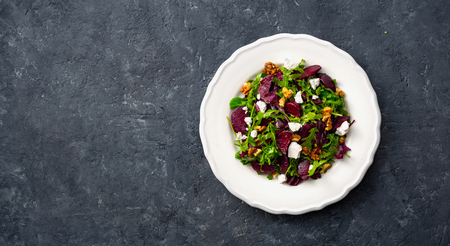Salad plate on a dark  top viewの写真素材