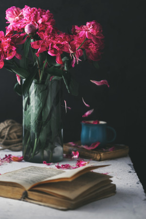 Bouquet of flower peonies inÂ vase on a darkの写真素材