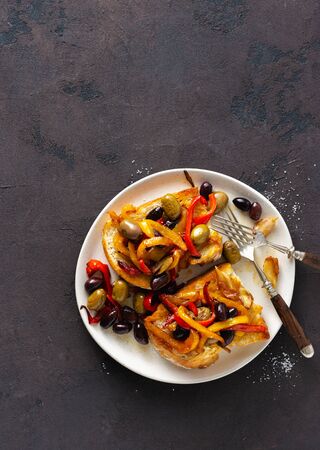 Sandwiches with smoke peppers, olives and garlic on a light background, top view. Flat layの写真素材