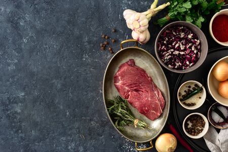 Raw steak with ingredients for cooking healthy food top viewの写真素材