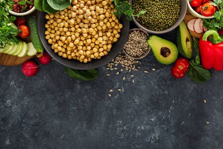 Variety raw vegetables and cereals top view copy space. Ingredients for cooking vegetarian foodの写真素材