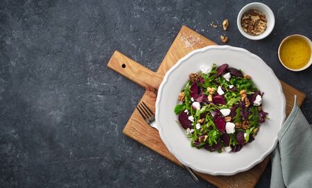 Salad plate on a dark background top viewの写真素材
