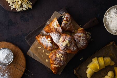 breakfast croissant with chocolate on a dark stone background top viewの写真素材