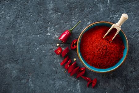 Chili pepper powder on dark background with copy space top viewの写真素材