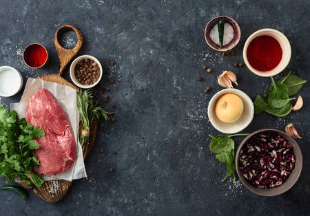 Food menu. Cooking table with beef meat, vegetables, spices, beans and herbs top viewの写真素材