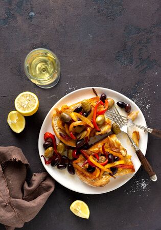 Sandwiches with smoke peppers, olives and garlic on a light background, top view. Flat layの写真素材