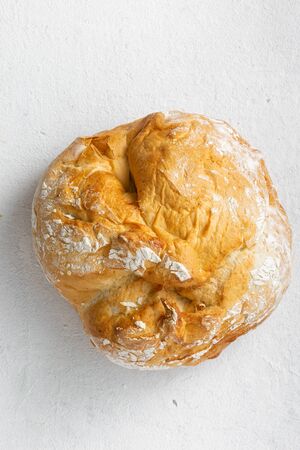 Bread loaf on a white background top viewの写真素材
