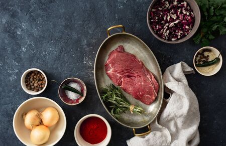 Raw steak with ingredients for cooking healthy food top viewの写真素材