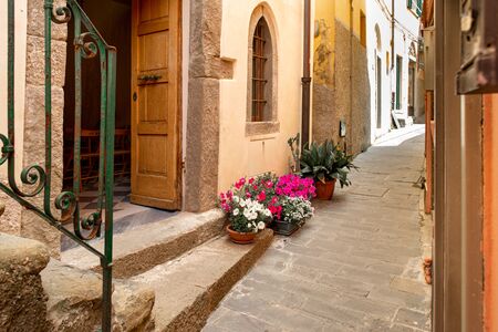 Riomaggiore in Cinque Terre, Italy. Beautiful narrow streets with church. Summer cityscapeの写真素材