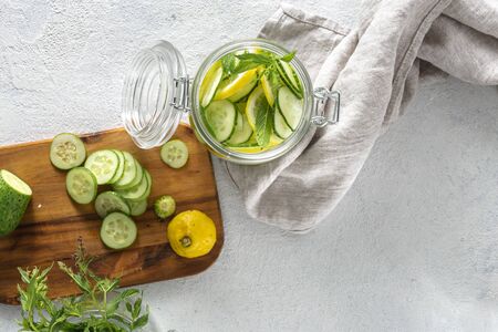 Diet concept. Cooking detox water. Cucumber drink recipe top viewの写真素材