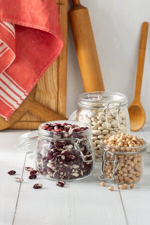 Raw grain bean in a glass jar in home kitchen. Source of protein for vegetarianの写真素材