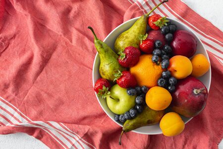 Mix fruits plate on a light  top viewの写真素材