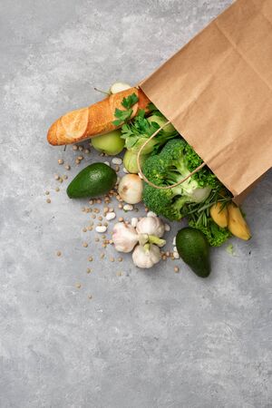 Shopping bag groceries with healthy food top view on a concrete background copy spaceの写真素材
