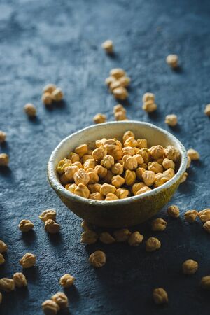 Bowl with chickpea close up on dark tableの写真素材