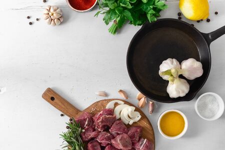 Ð¡ut of meat with vegetable on white wooden background top viewの写真素材