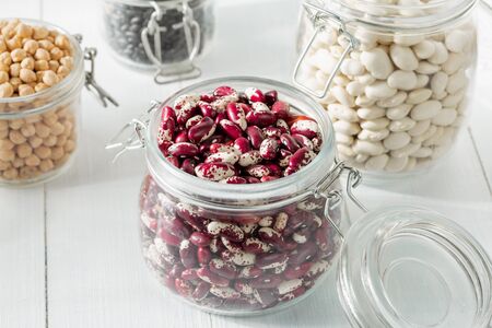 Raw different bean in a glass jar closeupの写真素材