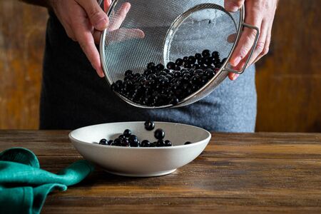 Pure blueberries on a wooden tableの写真素材