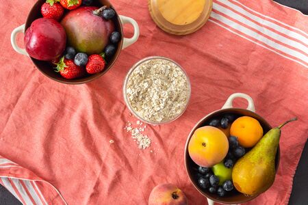 Raw Cereals with mix fruits plate on a light background top viewの写真素材