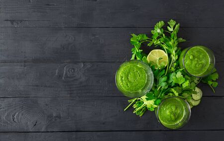 Detox diet concept. Green smoothie on a wooden  top viewの写真素材