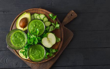 Detox diet concept. Green smoothie on a wooden  top viewの写真素材