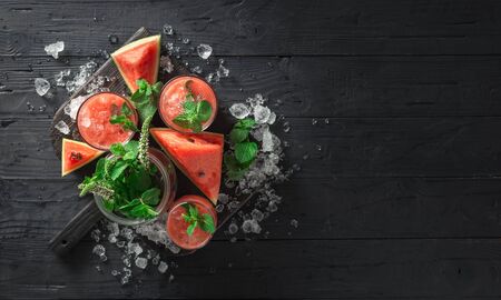 Top view cocktails drinks watermelon mojito on dark wooden  with copy spaceの写真素材