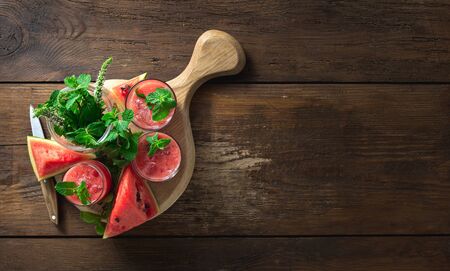 Summer drinks watermelon mojito on a wooden  with copy space top viewの写真素材