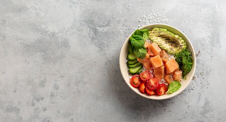 Healthy vegan food concept Poke bowl with salmon, avocado, vegetables and chia seedsの写真素材