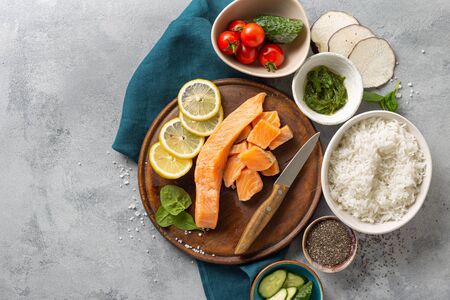 Healthy vegan food concept Ingredients for cooking poke bowl with salmon, avocado, vegetables and chia seeds top viewの写真素材