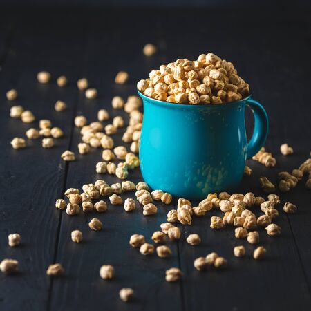 Bowl with chickpea close up on dark wooden tableの写真素材