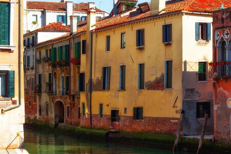 Canal in Venice, Italy with traditional colorful housesの写真素材