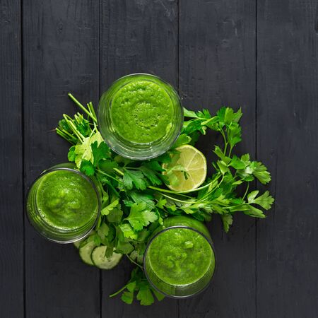 Detox diet concept. Green smoothie on a wooden background top viewの写真素材