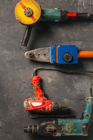 Construction worker tools on a dark background top viewの写真素材