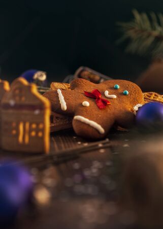 Christmas ginger cookies with decorations on dark backgroundの写真素材