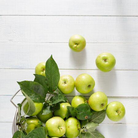 Fresh green apples in sieve top viewの写真素材