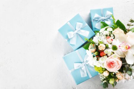 Flower bouquet with gift on white background Flat lay, top view. St. Valentine's Day, Love conceptの写真素材