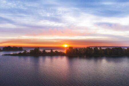 Beautiful sunrise over the river with an islandの写真素材