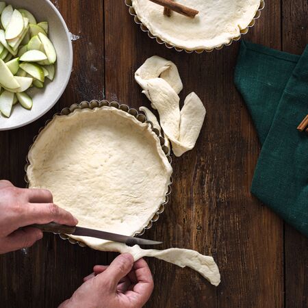 Man preparation homemade apple pie top viewの写真素材