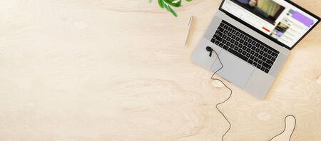 Online education or training concept top view. Laptop on the table with a live stream of teacher or coach. Copy spaceの写真素材